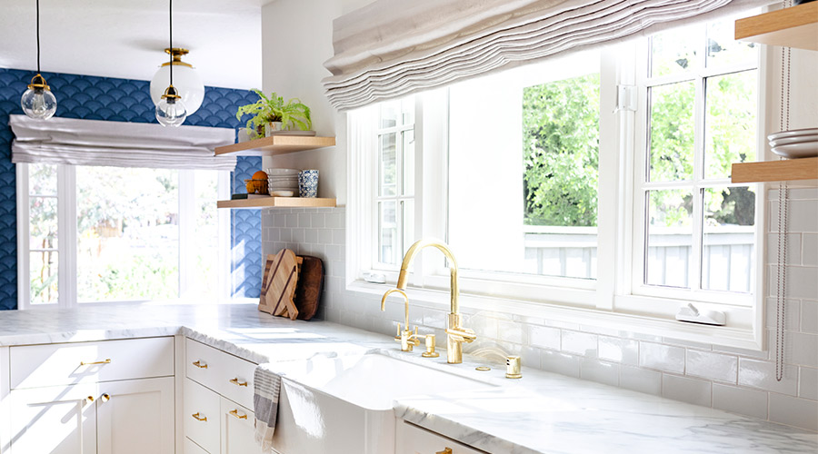 kitchen with windows above sink and white cabinets taylorsville ut